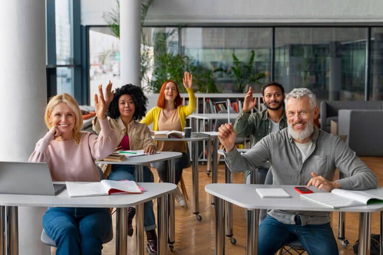 adults in their classroom sitting together.