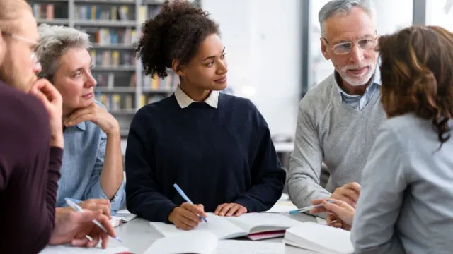 Close up people studying together