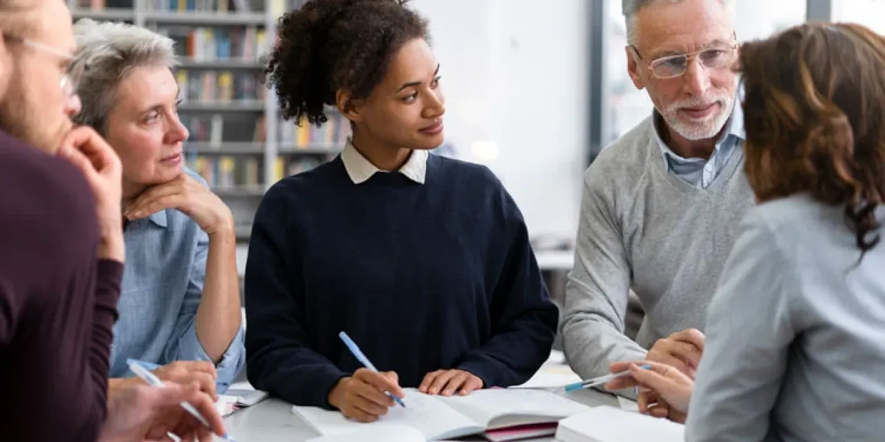 Close up people studying together
