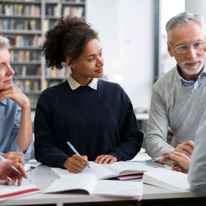 Close up people studying together